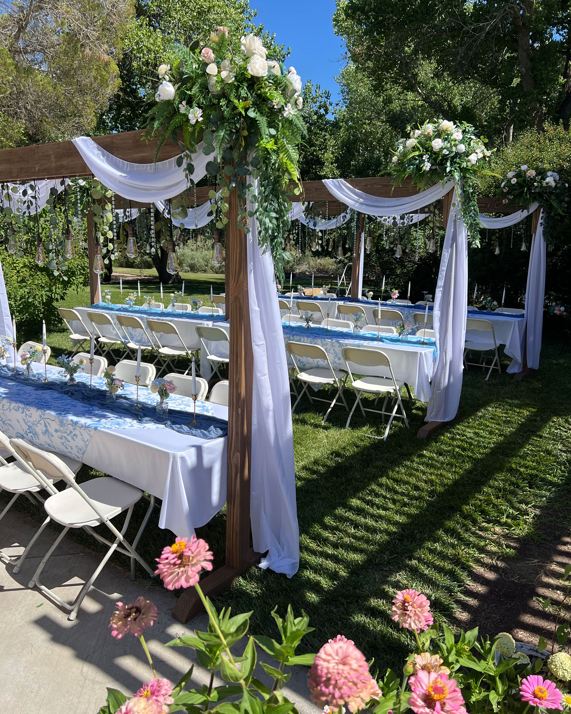 camdas-wedding-arches-rental-utah-rustic-lighted-table-arches-02 Backyard Wedding Reception featuring Cascading Vines Tan Ivory Floral on Rustic Lighted Table Arches in Fallon, Nevada.