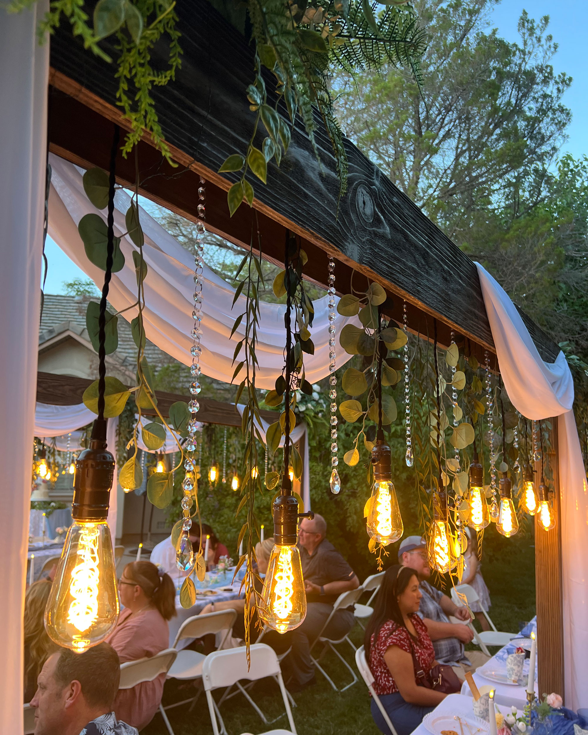 camdas-wedding-arches-rental-utah-rustic-lighted-table-arches-12 Backyard Wedding Reception featuring Cascading Vines Tan Ivory Floral on Rustic Lighted Table Arches in Fallon, Nevada.
