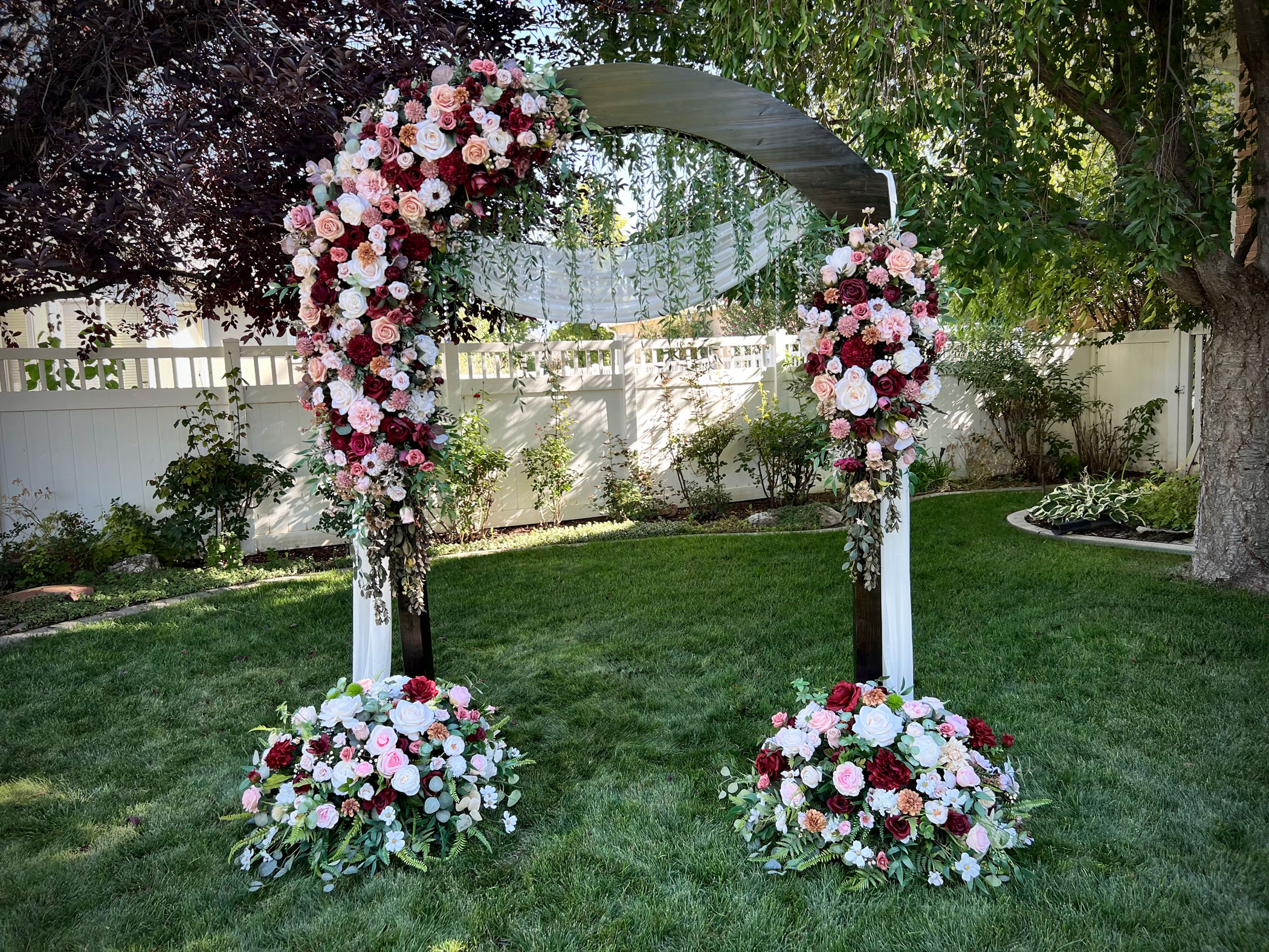 Autumn Burgundy Ivory Floral on Classic Dark Wedding Arch with coordinating floral arrangements in Spanish Fork, Utah