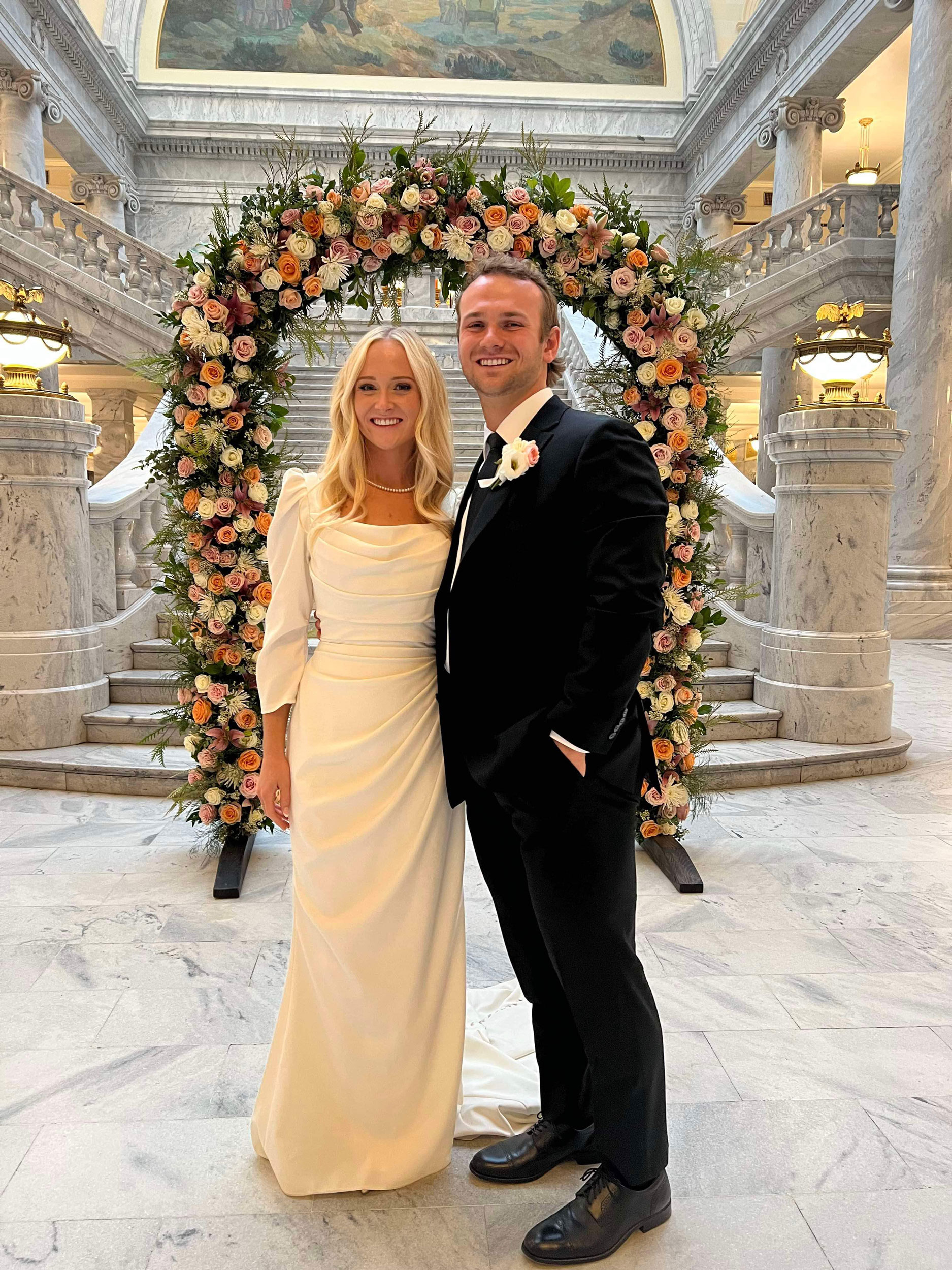 Wedding Ceremony featuring DIY Fresh Flowers Wedding Arch at Joseph Smith Memorial Building in Salt Lake City, Utah.