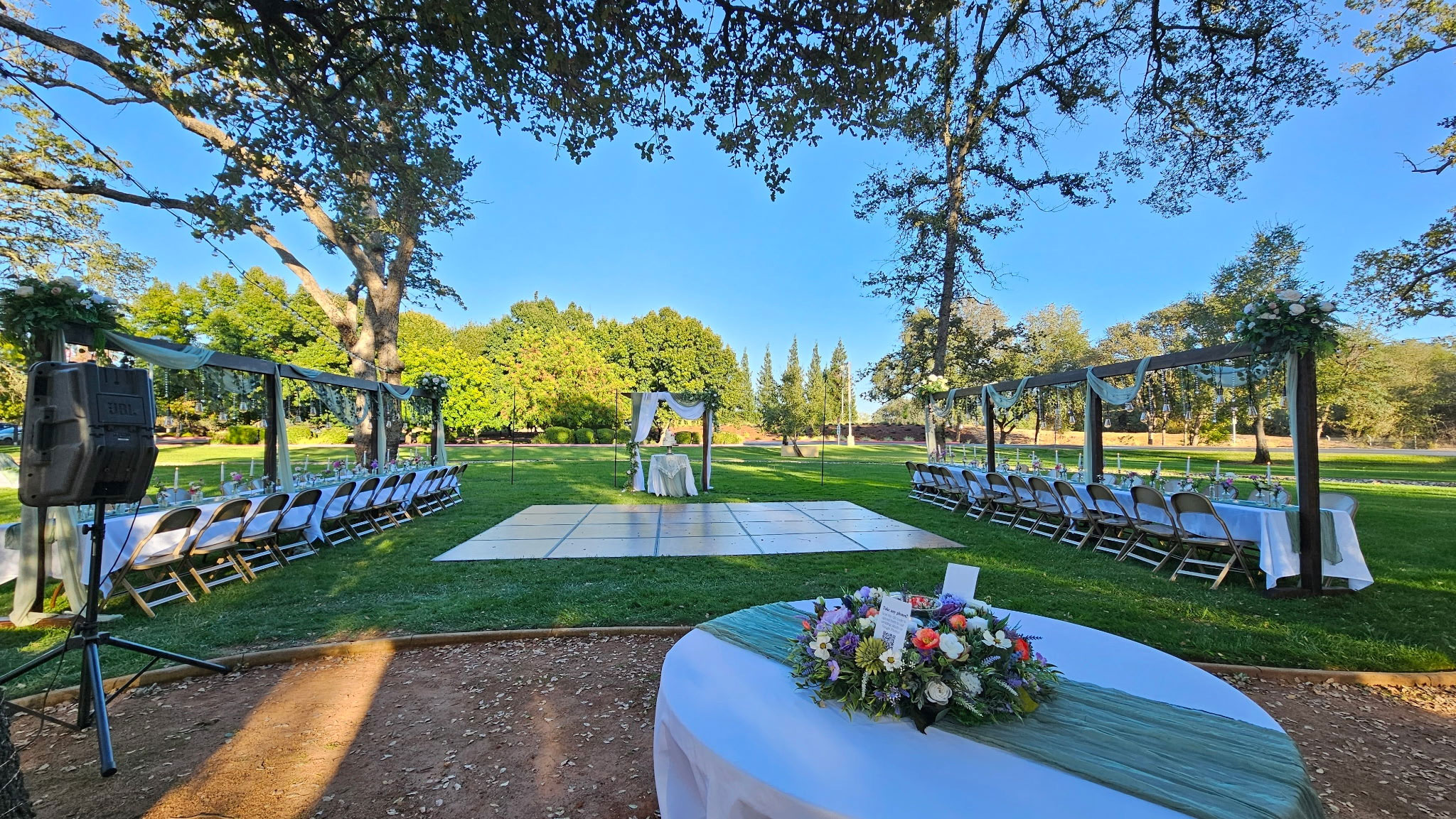 Wedding Reception featuring Wildflower Floral Lighted Table Arches at Rancho Cordova Park in Carmichael, California.