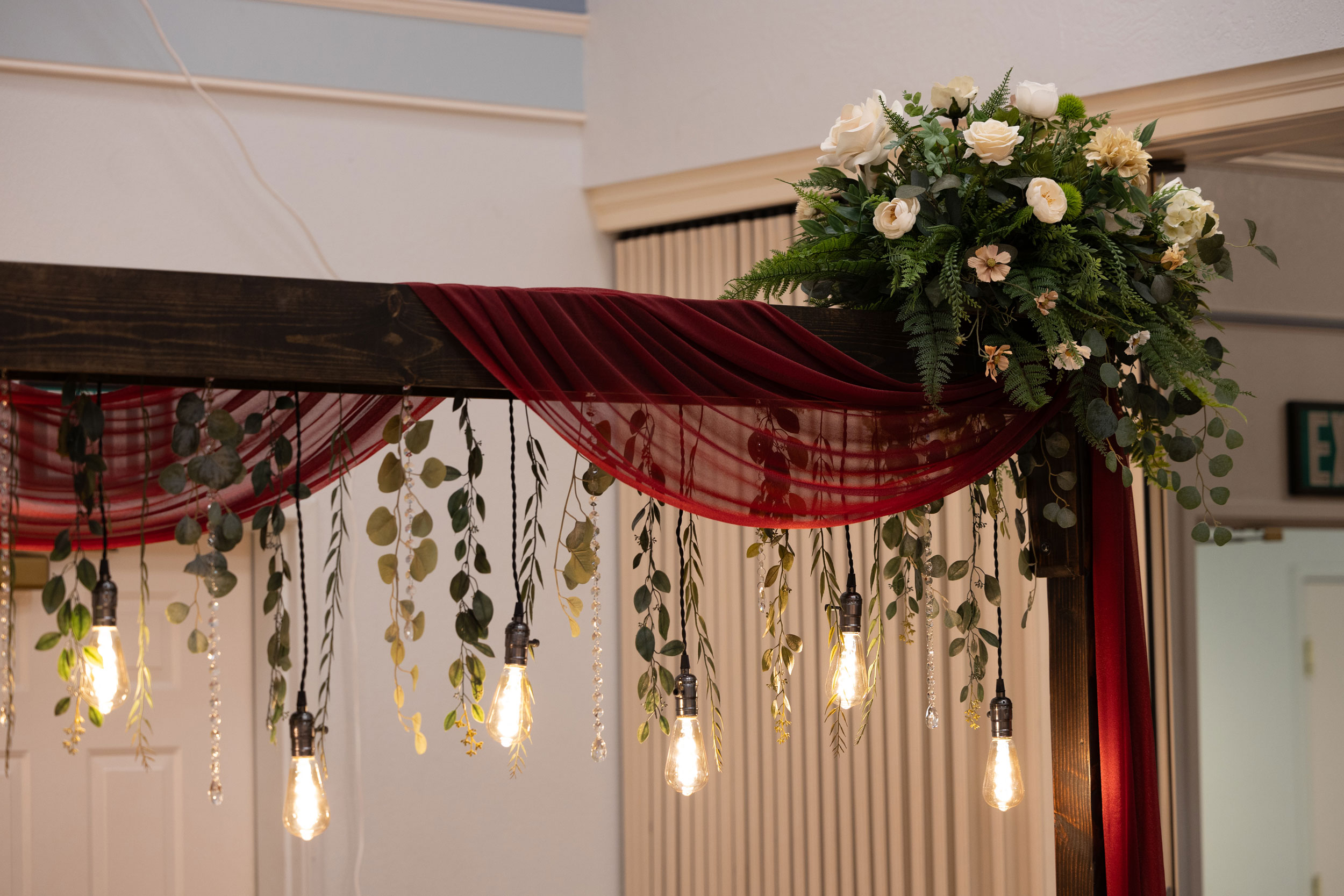 Wedding Reception featuring Cascading Vines Tan Ivory Floral Lighted Table Arches at LDS Chapel in Orem, Utah.