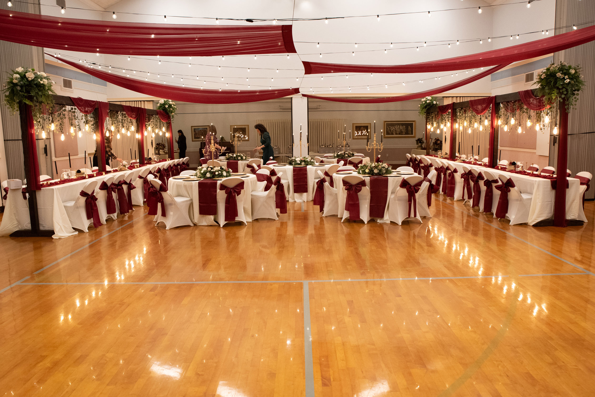 Wedding Reception featuring Burgundy Pink Ivory Floral Lighted Table Arches at LDS Chapel in Orem, Utah.