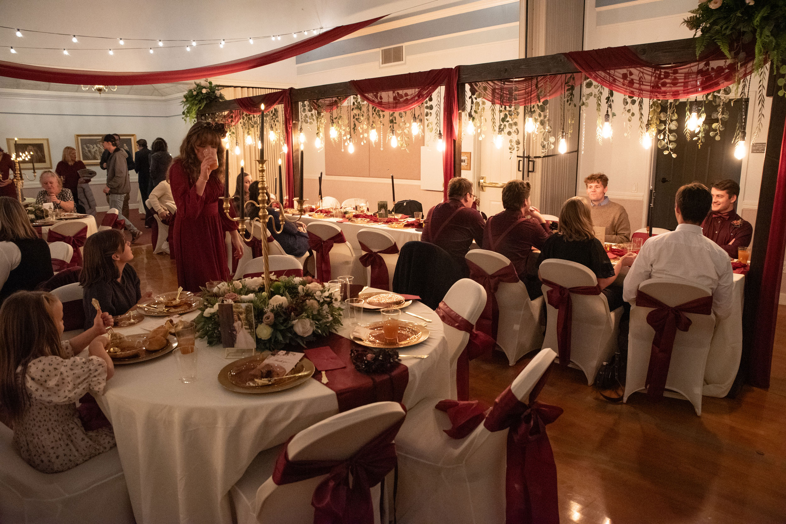 Wedding Reception featuring Burgundy Pink Ivory Floral Lighted Table Arches at LDS Chapel in Orem, Utah.