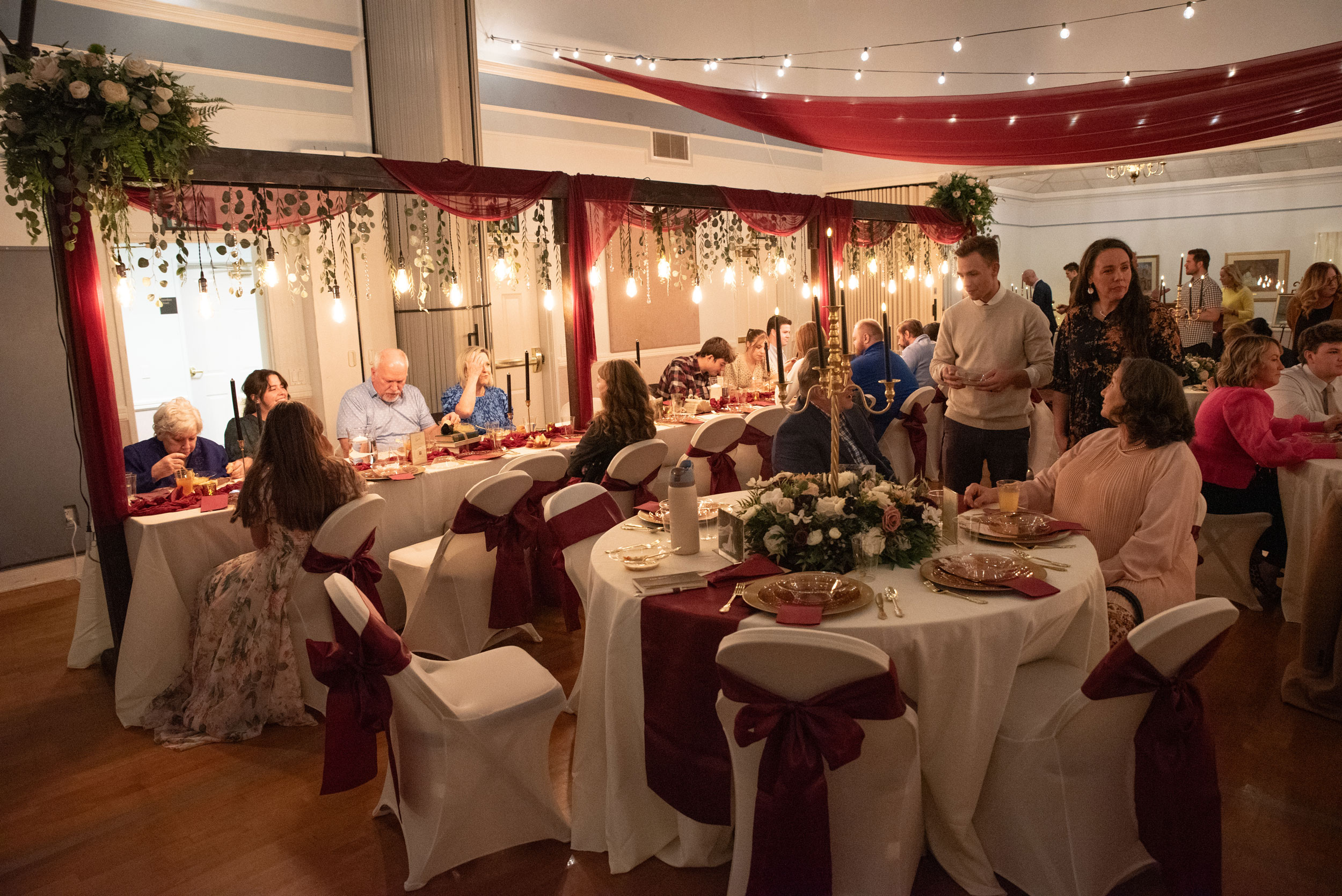 Wedding Reception featuring Burgundy Pink Ivory Floral Lighted Table Arches at LDS Chapel in Orem, Utah.