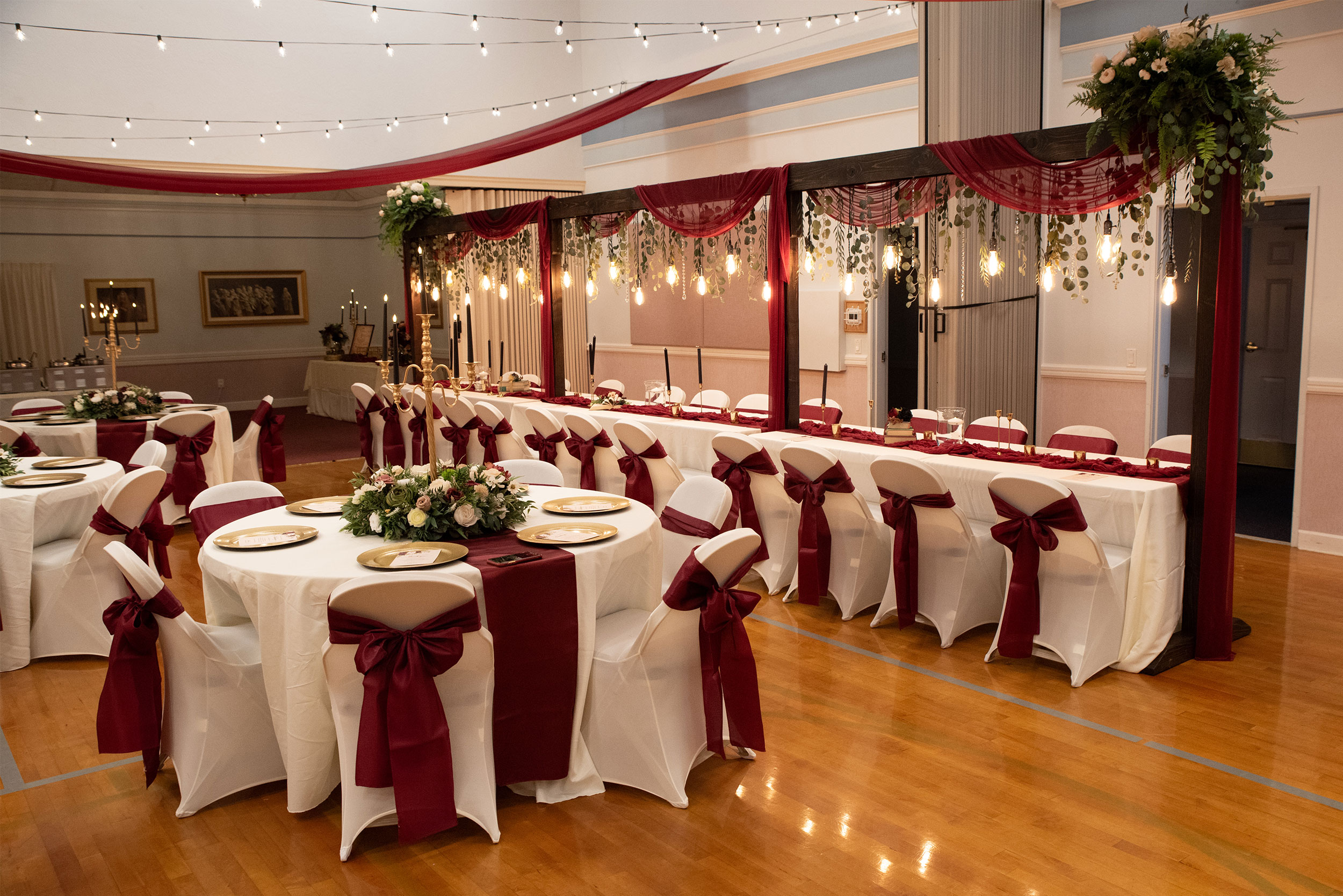 Wedding Reception featuring Burgundy Pink Ivory Floral Lighted Table Arches at LDS Chapel in Orem, Utah.