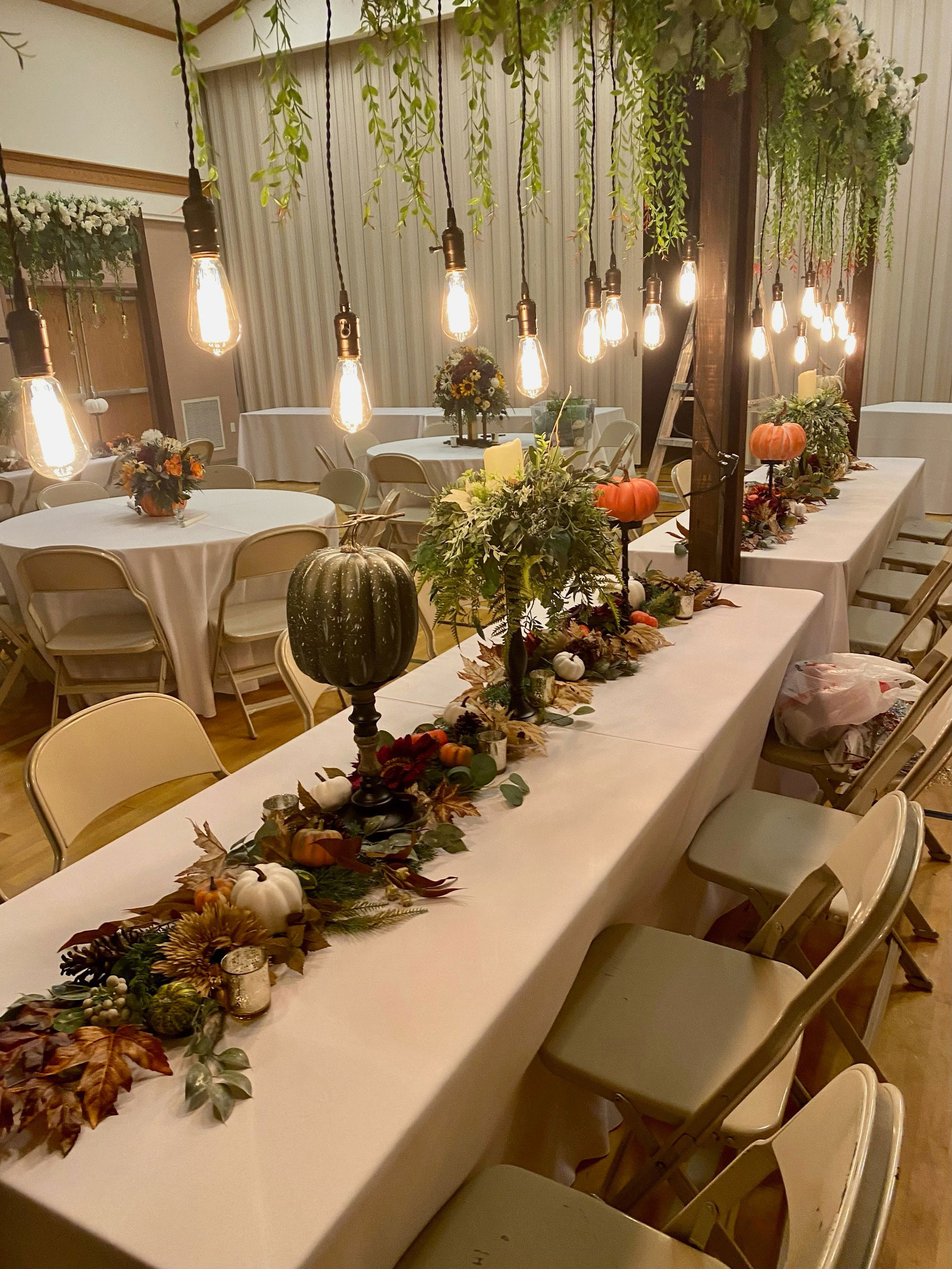 Wedding Reception featuring Fall Sunflower Floral Lighted Table Arches at LDS Chapel in Spanish Fork, Utah.