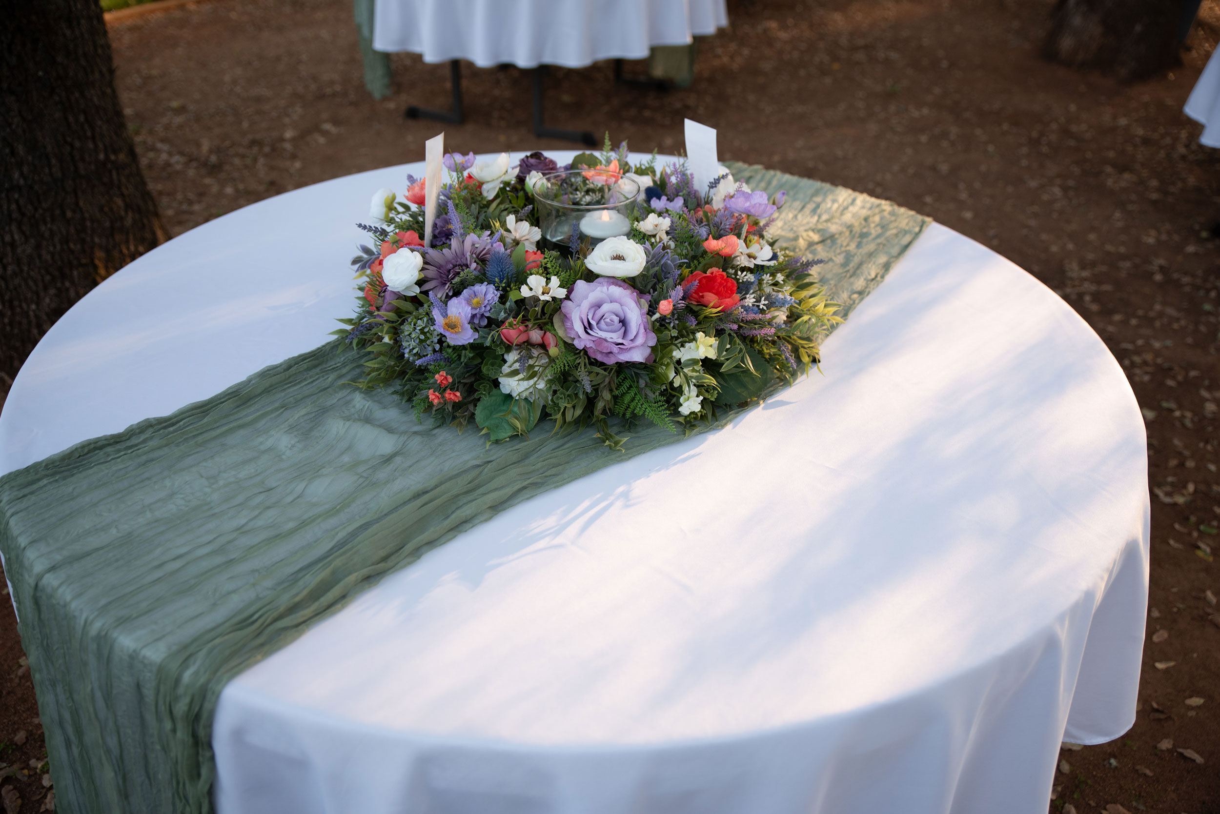 Wedding Reception featuring Wildflower Floral Table Wreath at Rancho Cordova Park in Carmichael, California.
